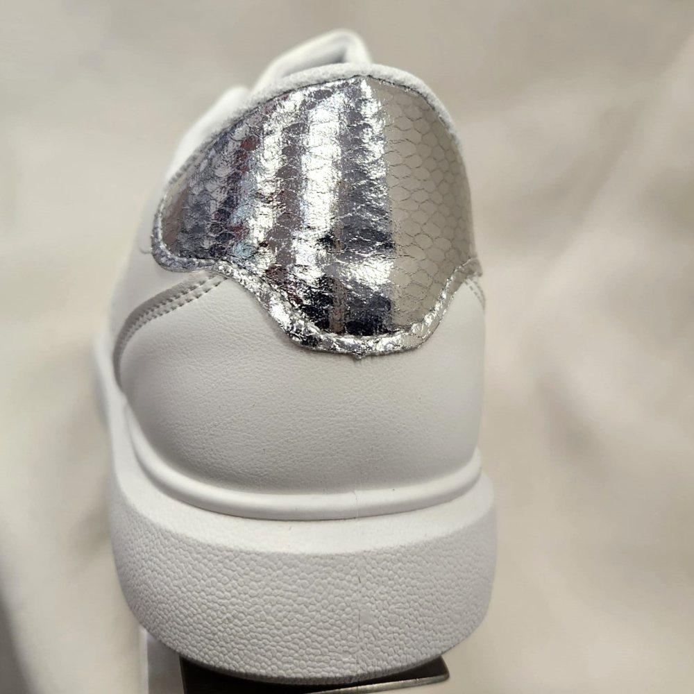 Rear view of white runners with silver accent