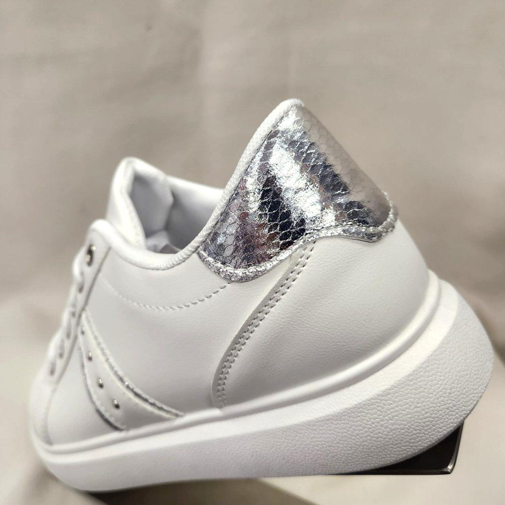Another rear view of white runners