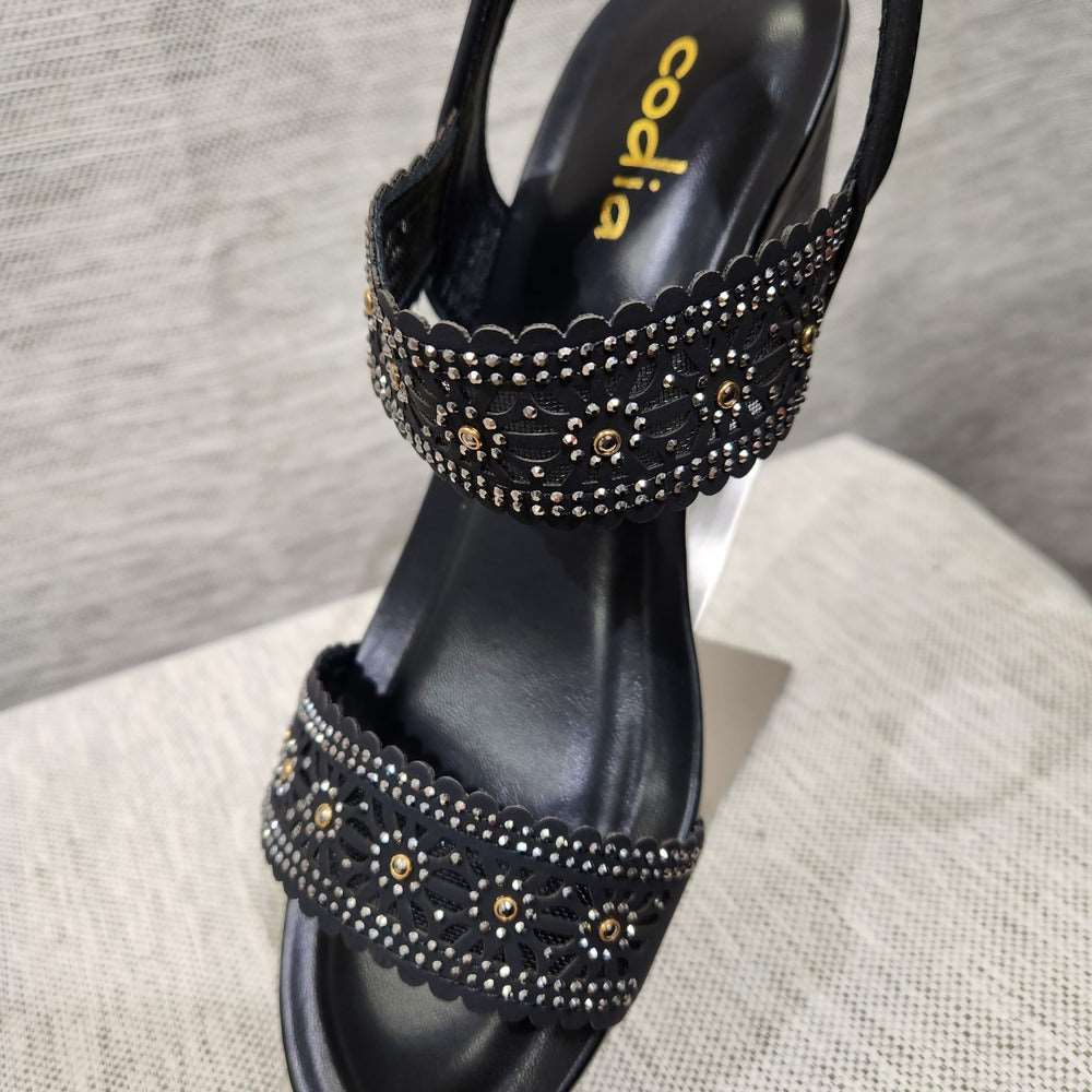 Detailed view of two stone embellished upper mesh base straps with cut-out design