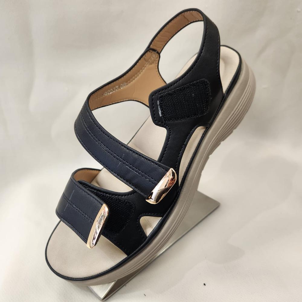 Velcro closure of black summer sandals