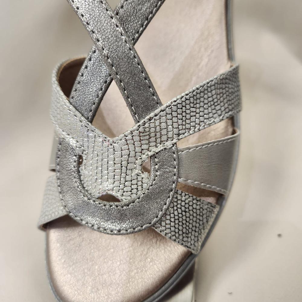 Detailed front view of dull silver summer sandals