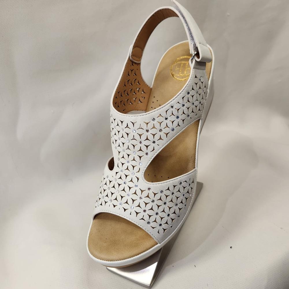 Front view of Elegant white summer sandal with velcro closure back strap