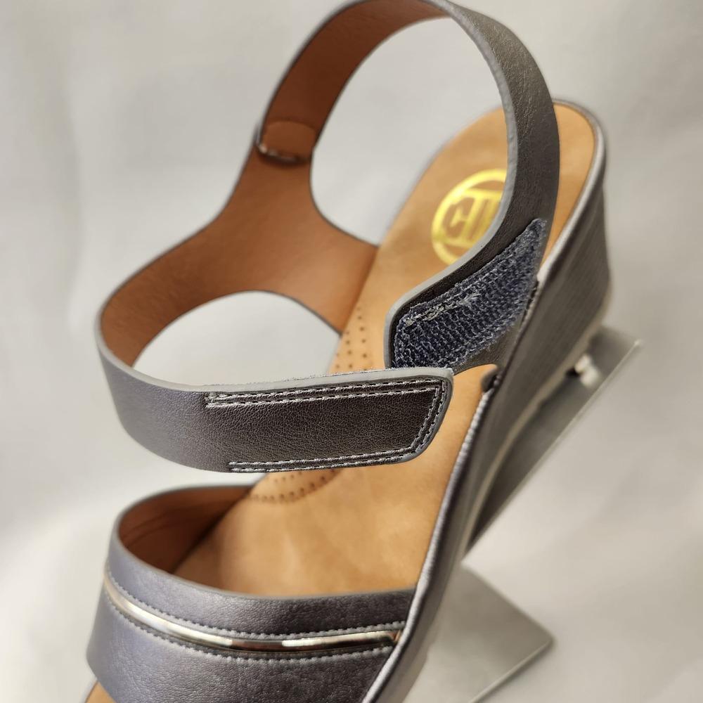 Detailed view of velcro closure back of pewter summer sandals