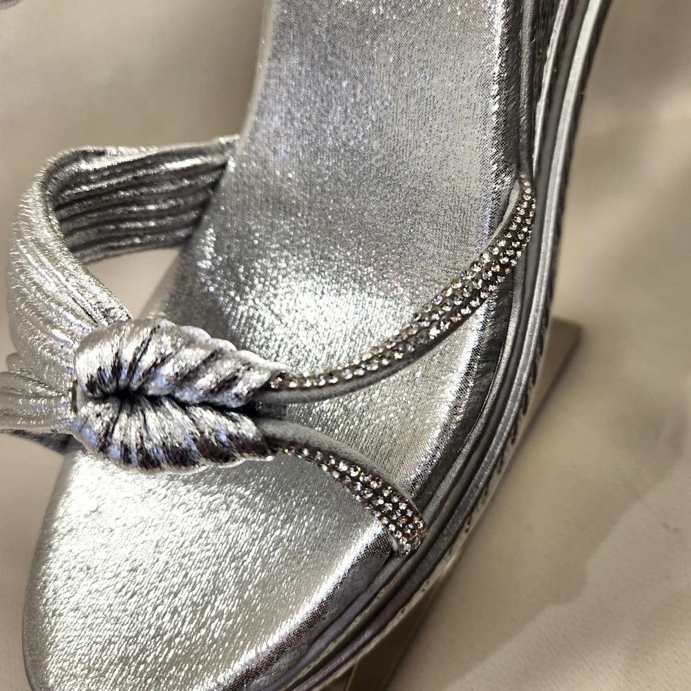 Detailed front view of silver summer sandals