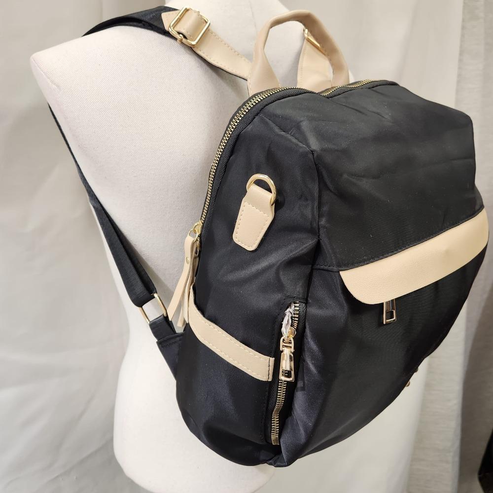 Multiple compartment black backpack with beige trim