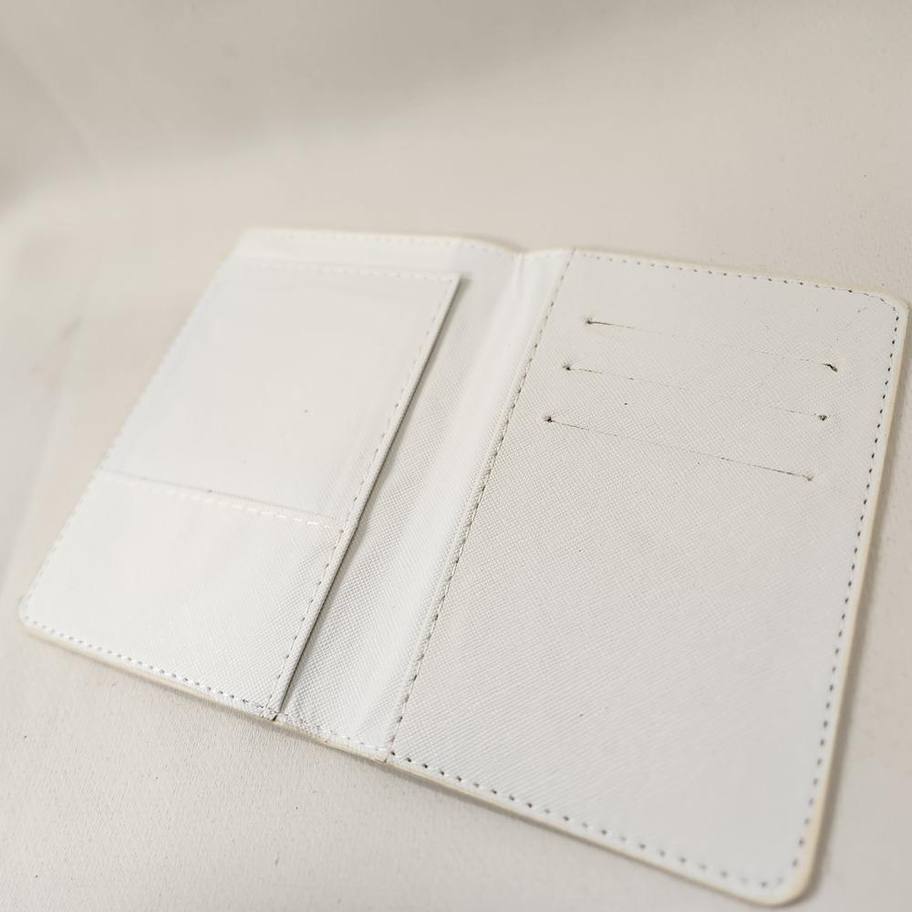 Black and white checkered print passport cover when opened