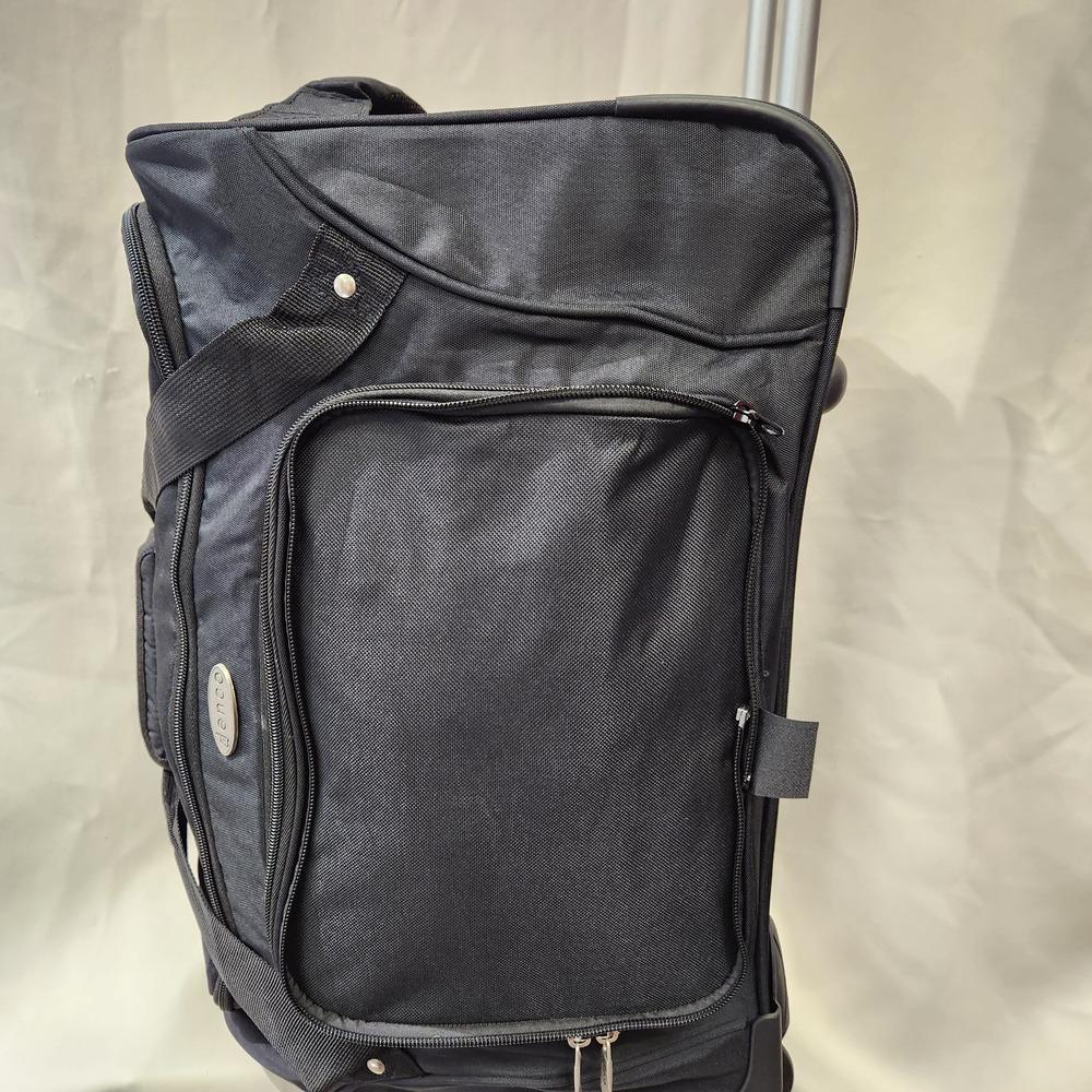 Closer side view of black travel bag on wheels
