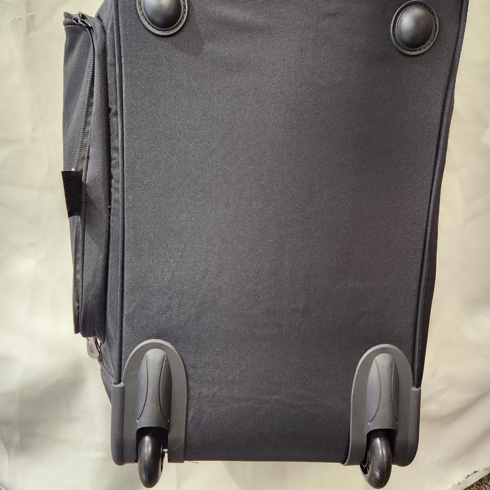 The two wheels on the bottom of travel bag