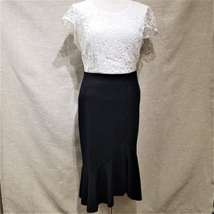 Full view of Black skirt with flared hemline and self color stones