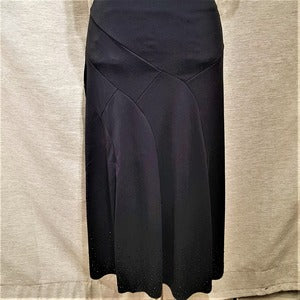 Detailed view of Black skirt with panels and stone embellishment
