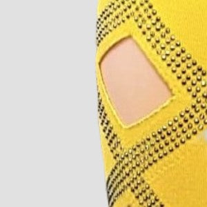 Detailed view of the cut-out design on yellow leggings