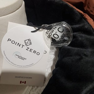 View of Point zero label on Winter jacket in cognac color