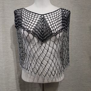 View of dressy black capelet with shimmery beads
