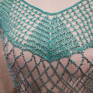 Detailed view of dressy turquoise blue capelet with shimmery beads
