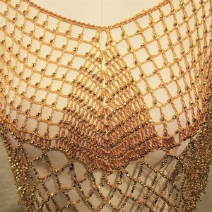 Detailed view of dressy yellow capelet with shimmery beads
