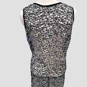 Lace back of sleeveless V neckline blouse