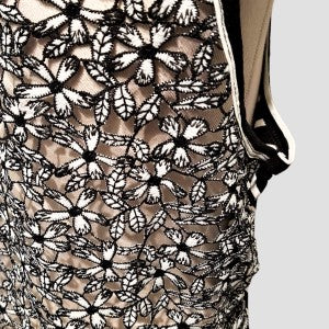 Detailed view of black and white lace back