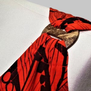 Decorative shoulder detail of red with black print summer top