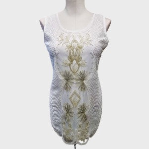 Full view of fancy white sleeveless sequin top with round neckline