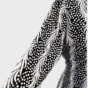 Detailed view of the three quarter length sleeves