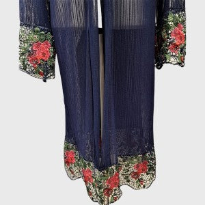 Closer view of blue long sheer material shrug with colorful lace