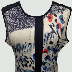 Neckline detail of sleeveless top in multi-colored print
