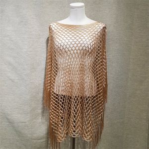 Gold color poncho with tassels