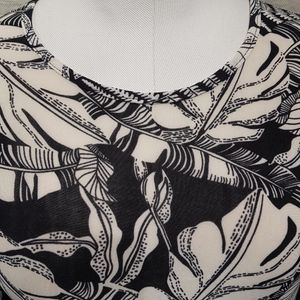 Neckline detail of printed black and white top