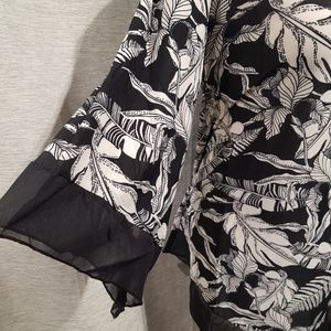 Sleeve detail of black and white printed top