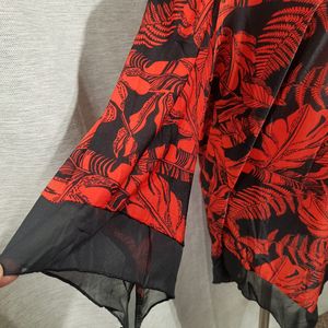 Sleeves of printed black and red top