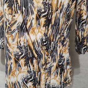 Gathering detail of graphic print top