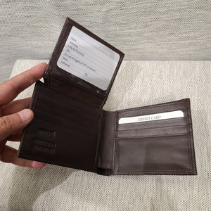 ID holder with thumb slide feature