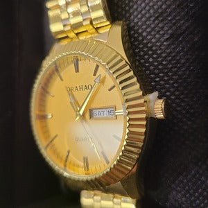 Side view of Wristwatch for men with gold frame and gold inner dial