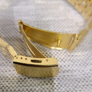 Another view of folding clasp on gold wristwatch