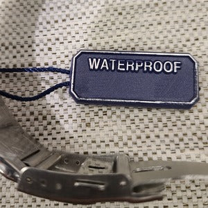 Tag on silver color men's watch