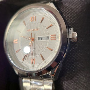 Side view of Round face wristwatch for men in silver color