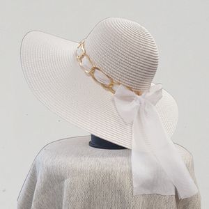 White floppy summer hat with bow tie