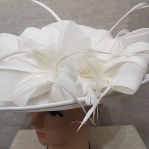 Feather embellihment on white dress hat