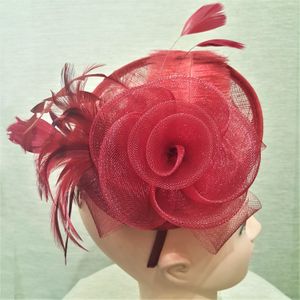 Top view of burgundy cambric with feathers fascinator