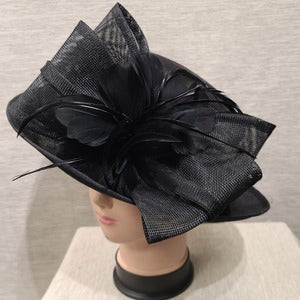 Side view of Formal dress hat in black with bow and feathers
