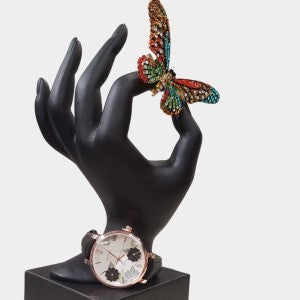 Wrist watch with black leather strap and round dial