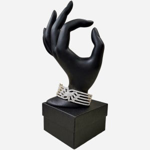 Hinged gold frame bracelet with clear stones