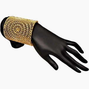 Wide cuff gold bracelet with cut-out pattern