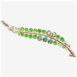 Leaf shaped brooch with green AB stones