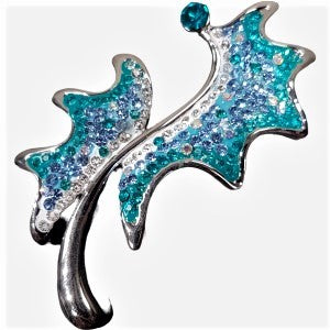 Brooch adorned with clear and blue stones