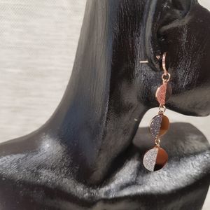 Push back post of rose gold dangle earrings