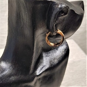 Latch back post detailed view of gold hoop earrings