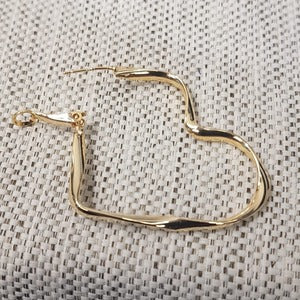 Another view of Heart shaped hoop earrings in gold color
