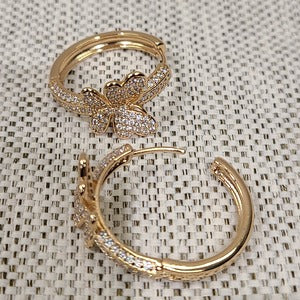 Latch back closure on stone studded hoop earrings