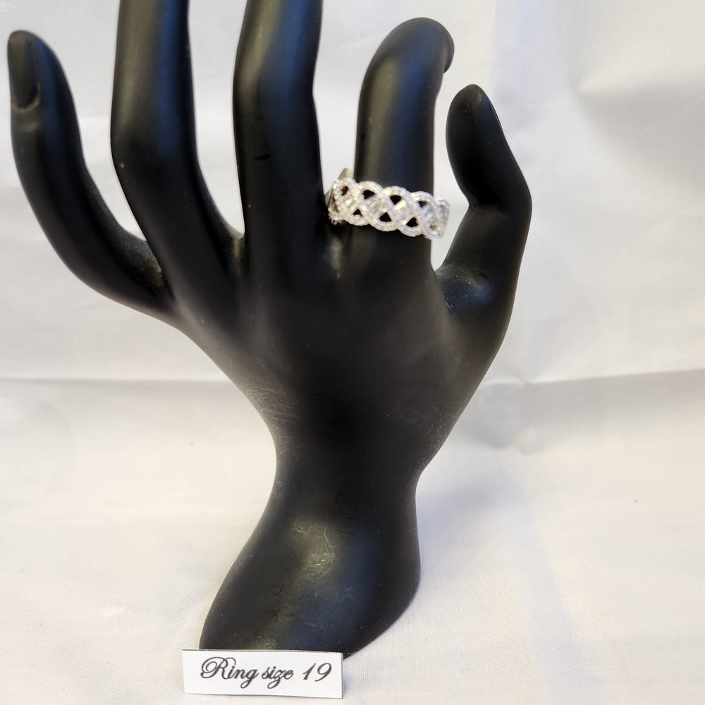Intertwined ring band displayed on a mannequin